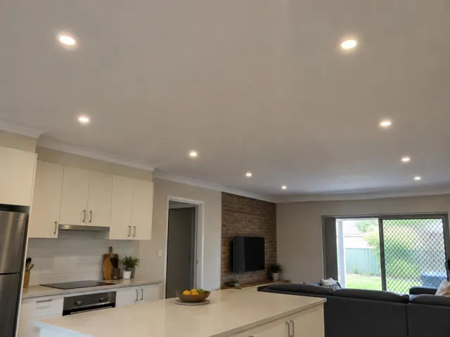 Kitchen and living area with flush LED downlights in a modern home in Lake Haven